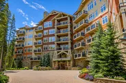 Luxury condos for sale in Keystone, Colorado surrounded by mountain scenery and evergreen forests