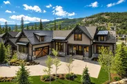Newly built mountain home surrounded by evergreens in Keystone, Colorado