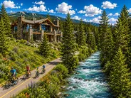 Luxury riverfront homes beside the Snake River bike path in Keystone, Colorado