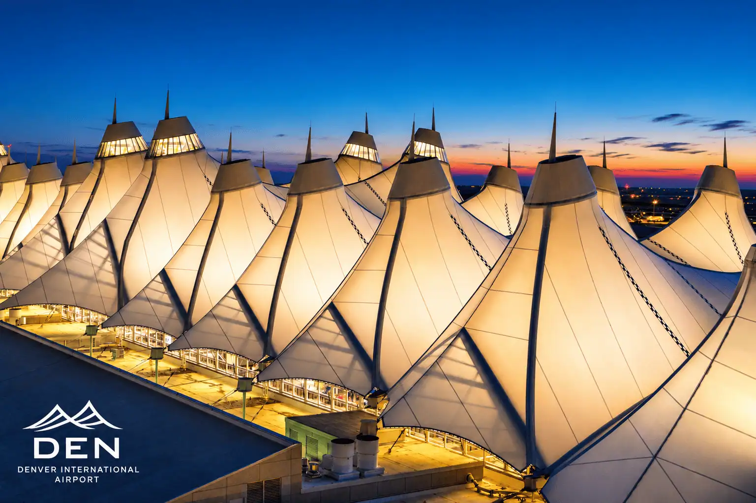 Evening arrival at Denver International Airport Denver International Airport terminal at dusk in Colorado